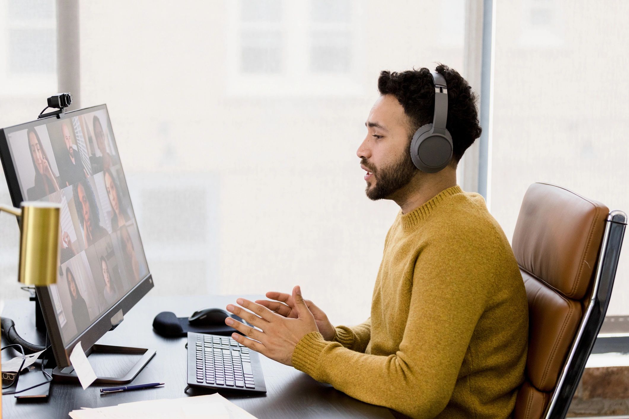 Creative professional leading a virtual team meeting